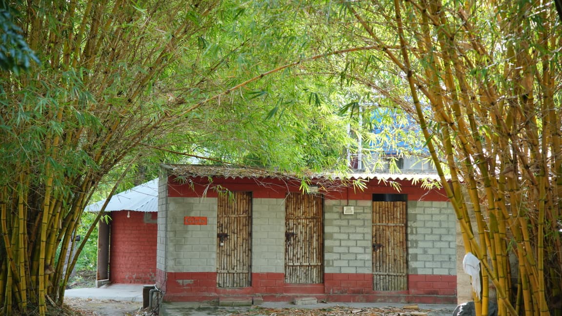 Bamboo-doored workshop rooms under the bamboo grove at Iyal Farm